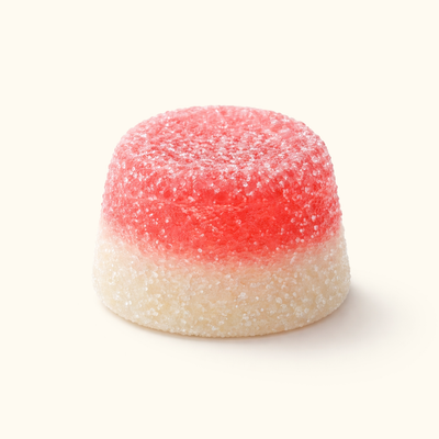 Two-layered 4-pro-met Gummy with red top and white bottom on a white background